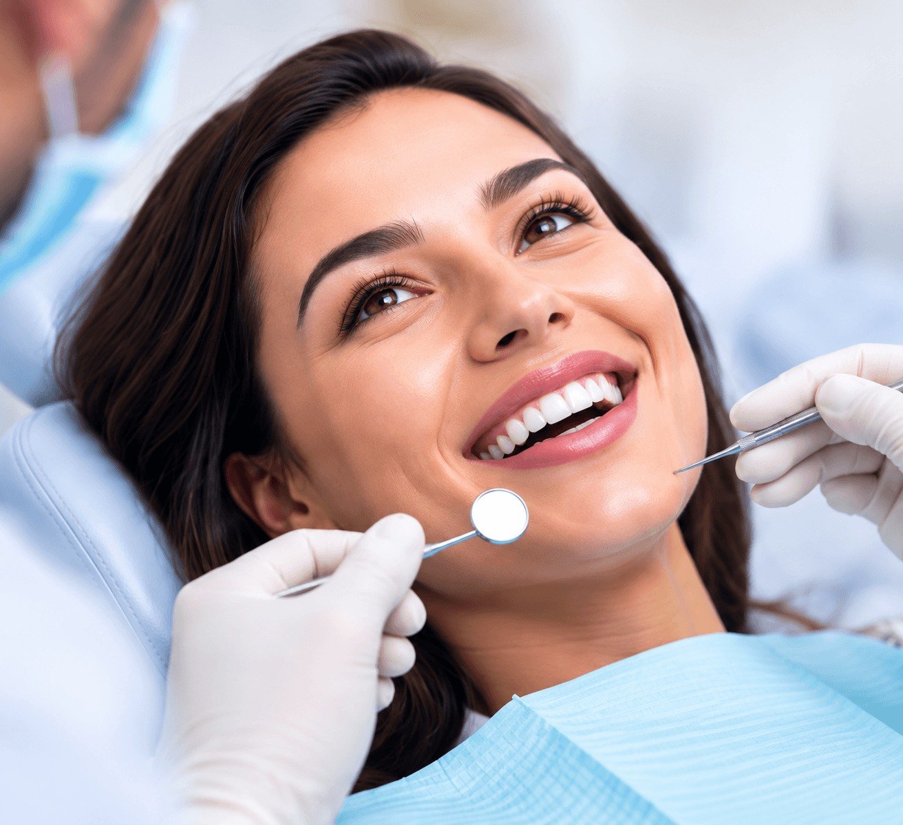Smiling woman relaxing in the dental chair during a gentle treatment